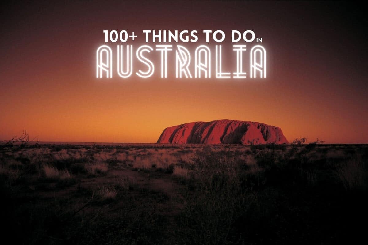 Things to do in Australia - Australia Bucket List Header image of Uluru at Dusk with text overlay stating 100+ Things to do in Australia