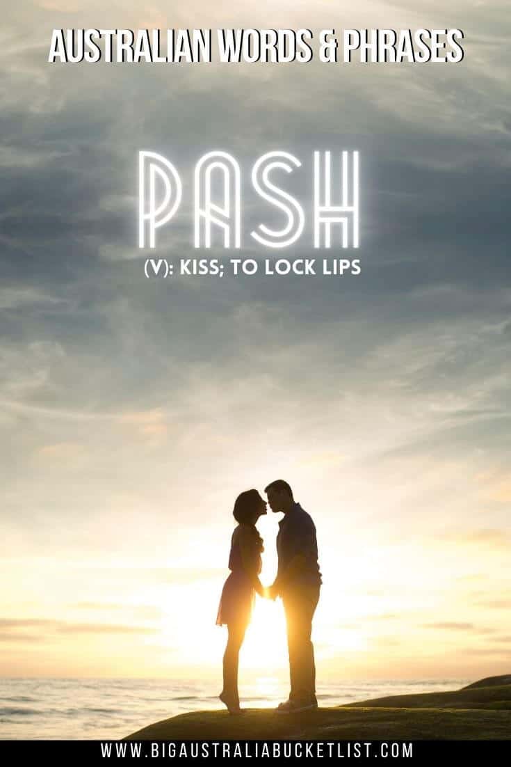 Aussie Slang - Pash = Kiss (featuring the silhouette of a man and a woman standing on a rock just about to kiss in front of a sunset the shines between them with text overlay of the translation above them)