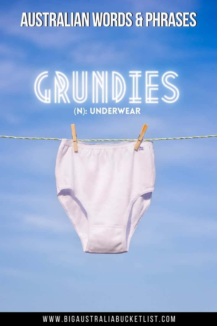 Aussie Slang Words - Grundies = Underwear (featuring a pair of white underpants on a washigline with a blue sky background with text overlay of the translation above)
