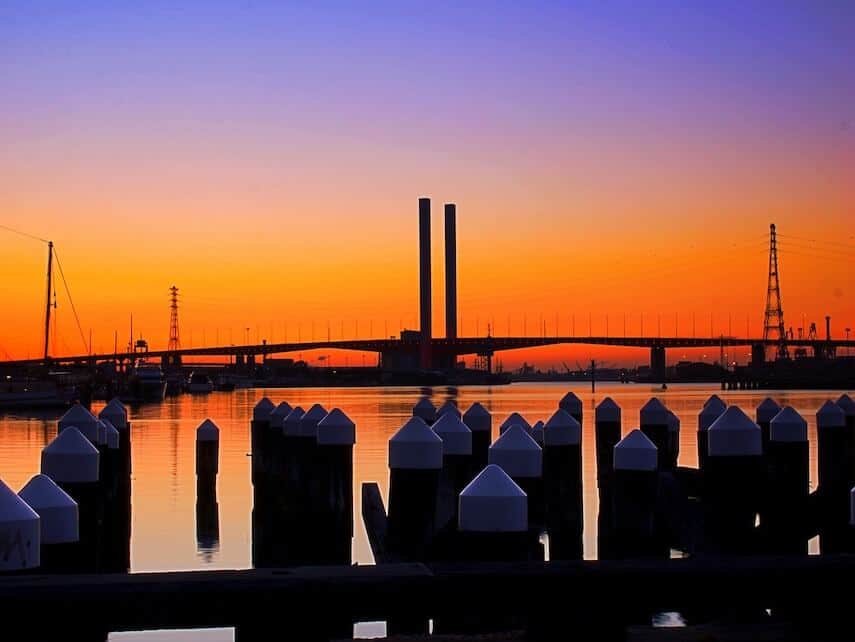 Sunset over the Bolte Bridge from behind the Bollards in the dock