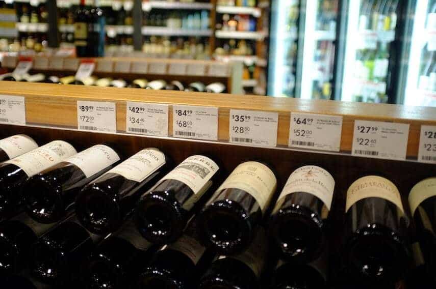 wine bottles on display in a liquor store