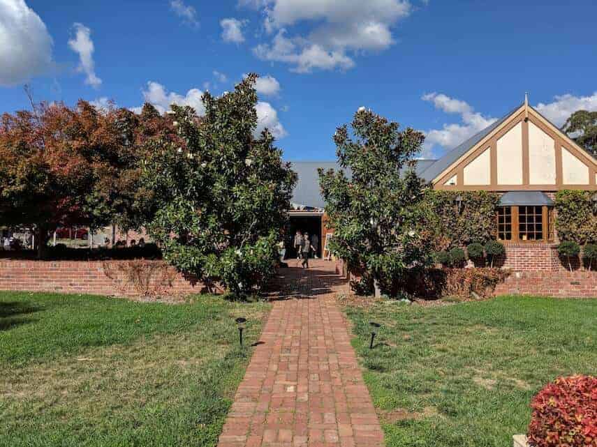 Daylesford Cider Company building with path leading down the middle with trees either side