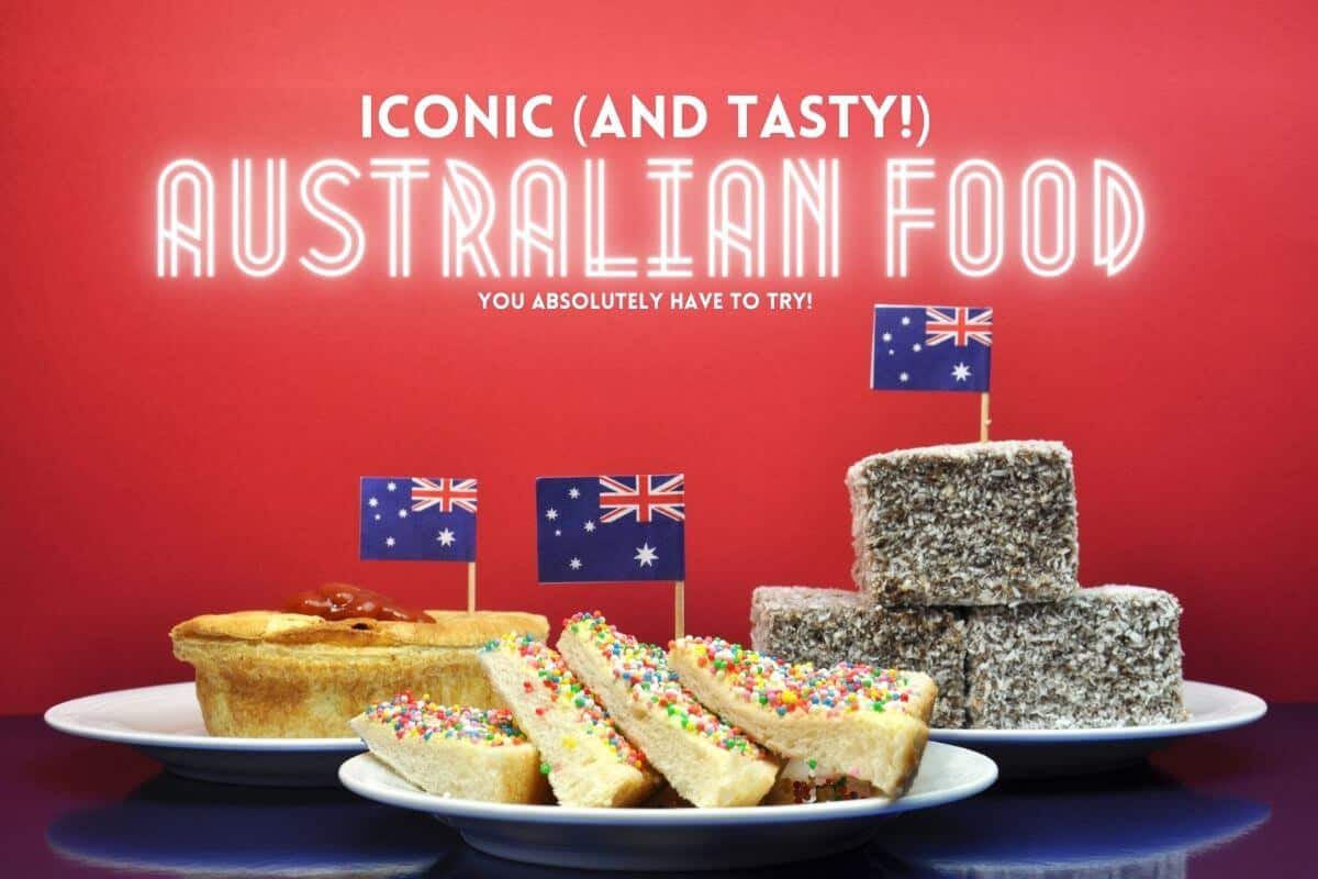Iconic Australian Food Header Image of three plates each containing a meat pie, fairy read and lamingtons with a cocktail Australia flag in each with a red background and title text overlay