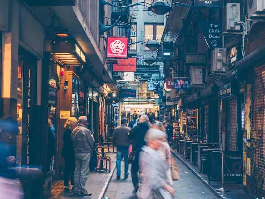 Melbourne Arcade laneway with shops either side and people walking up and down