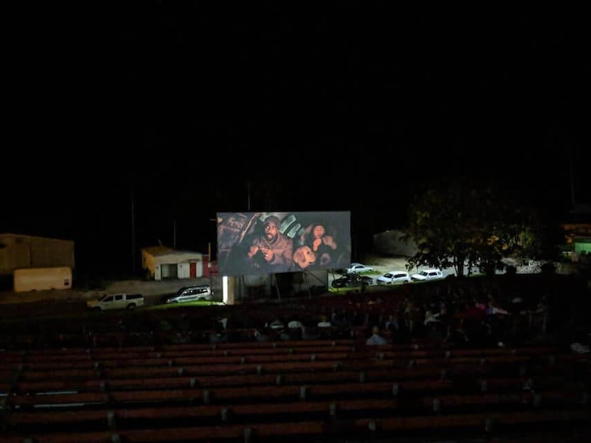Outdoor Cinema screen showing a movie at night on Christmas Island