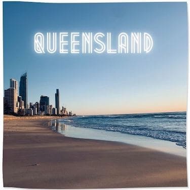 Link Tile to Queensland Category - image of a beach with skyscrapers in the distance