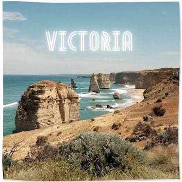 Link Tile to Victoria Category - image of the 12 Apostles on the Great Ocean Road, rock formations standing just ofshore with the waves lapping around them