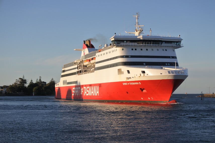 Red and white Spirit of Tasmania ship on a flat ocean
