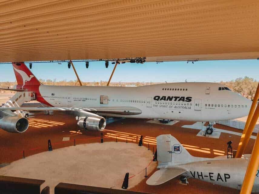 Qantas Founders Museum with an old Qantas plane under a beige tarp outside in Outback Queensland
