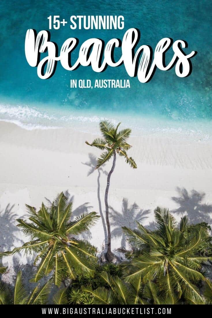 Guide to the Best Beaches in Queensland pin image: an aerial photo of a white sand beach lined with palm trees and clear blue water lapping at the sand. Text overlay at the top says 