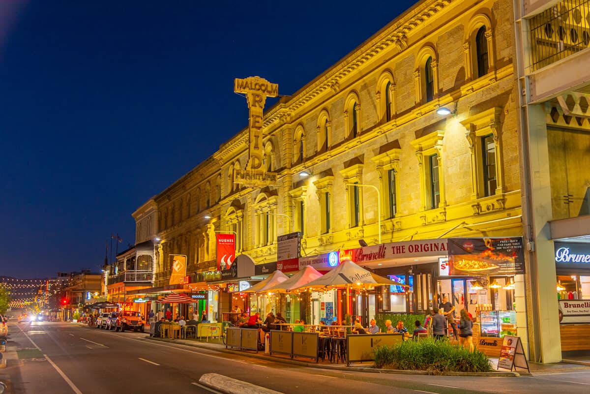 The Best Restaurants in Adelaide South Australia - street lined with cafes and restaurants with outdoor seating, lit up at night