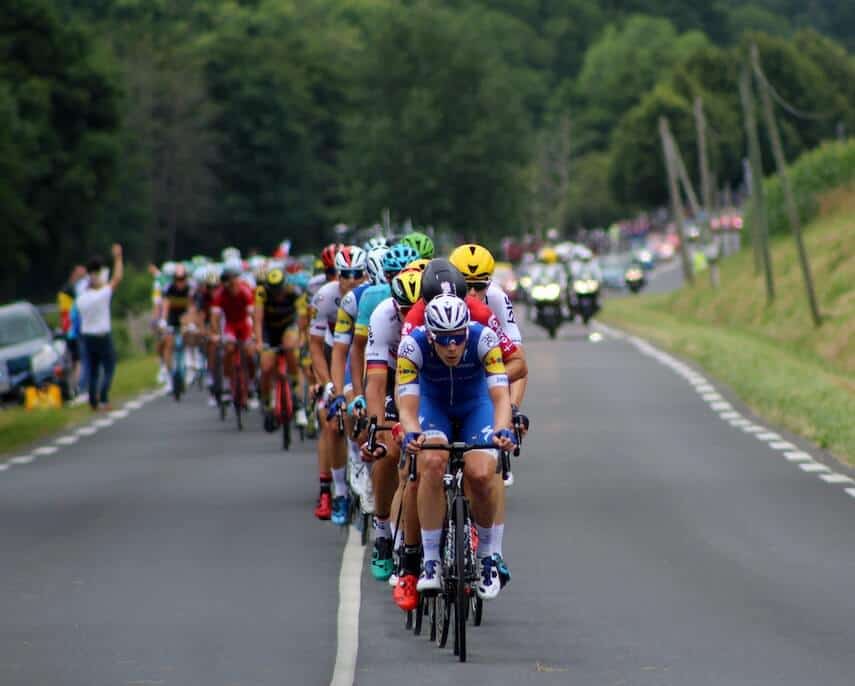 Cyclists on the road in a line in the Tour De France